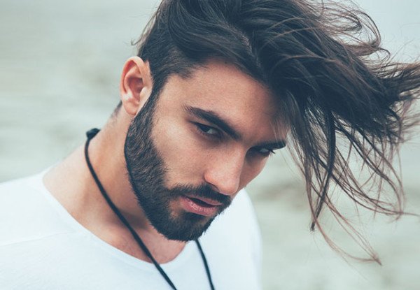 Portrait of a man with beard and modern hairstyle